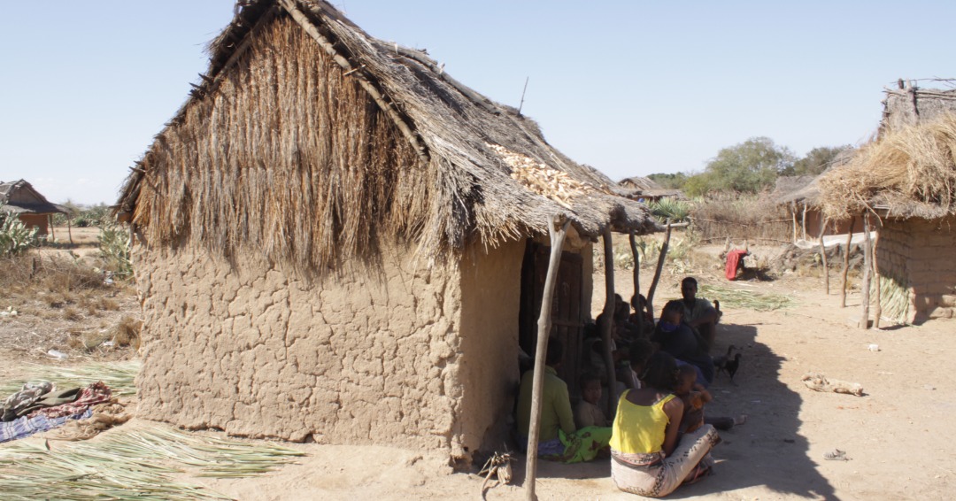 A family sits in the shade in Betioky, one of the regions affected by the severe drought in the south of Madagascar